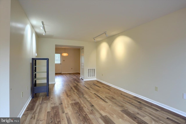 205 Saddle Ridge Dr, Harrisburg, PA 17110 - unfurnished room with rail lighting, wood finished floors, and baseboards