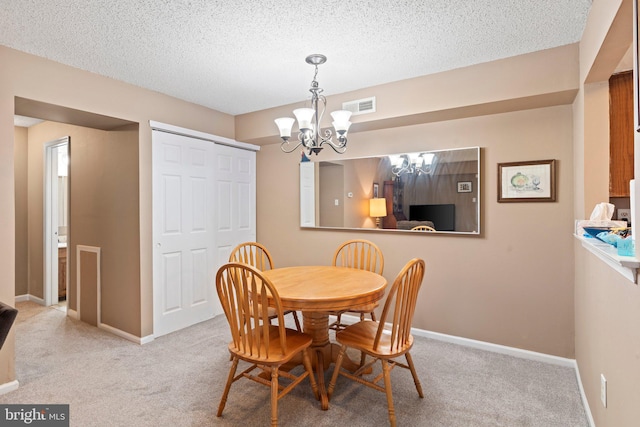 1206 Barry Ct, Southampton, PA 18966 - dining room featuring a chandelier, carpet floors, a textured ceiling, and baseboards