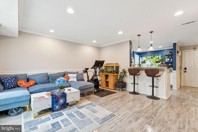 71 Sudbury Sq, Sterling, VA 20164 - living room featuring recessed lighting, ornamental molding, and light wood-style floors