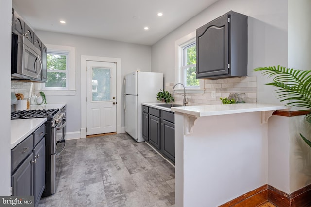 3023 Chesley, Baltimore, MD 21234 - kitchen with appliances with stainless steel finishes, a sink, healthy amount of natural light, gray cabinetry, and recessed lighting