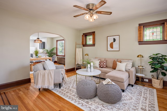 3023 Chesley, Baltimore, MD 21234 - living area featuring arched walkways, a ceiling fan, wood finished floors, and baseboards