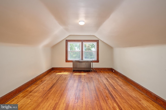 3023 Chesley, Baltimore, MD 21234 - bonus room with radiator heating unit, light wood-style flooring, lofted ceiling, and baseboards