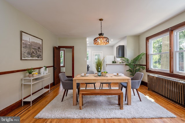 3023 Chesley, Baltimore, MD 21234 - dining room featuring radiator, wood finished floors, and healthy amount of natural light