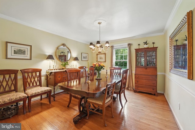 6090 Crown Royal Cir, Alexandria, VA 22310 - dining space with a chandelier, ornamental molding, and light wood-style floors