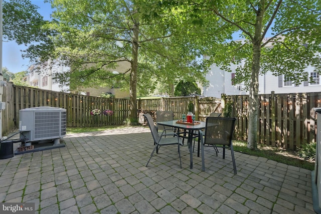 6090 Crown Royal Cir, Alexandria, VA 22310 - fenced backyard with outdoor dining area and a patio area