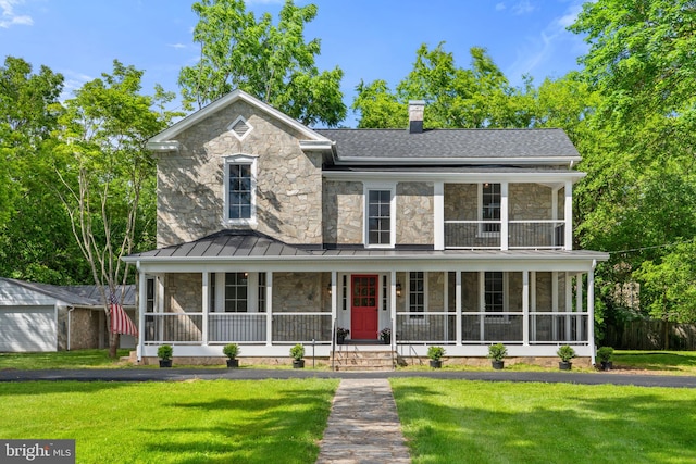 105 E Washington St, Remington, VA 22734 - view of front of home featuring stone siding, a porch, a standing seam roof, and a front yard