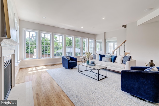 42720 Mount Auburn Pl, Broadlands, VA 20148 - living room with a premium fireplace, stairway, hardwood / wood-style floors, recessed lighting, and baseboards