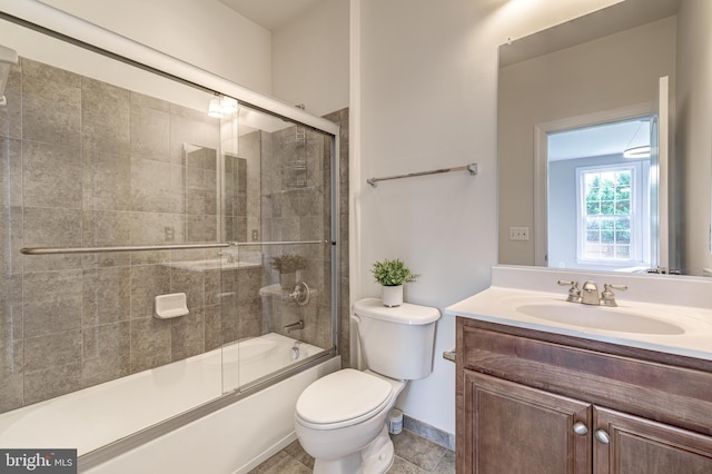 42720 Mount Auburn Pl, Broadlands, VA 20148 - full bath with toilet, vanity, bath / shower combo with glass door, and baseboards