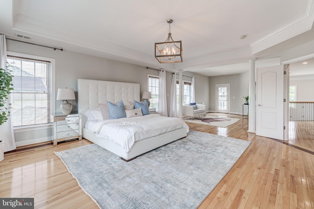 42720 Mount Auburn Pl, Broadlands, VA 20148 - bedroom with light wood finished floors, a chandelier, baseboards, and crown molding
