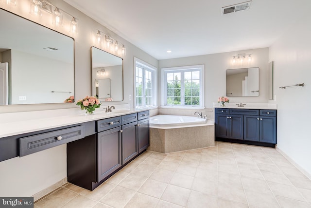 42720 Mount Auburn Pl, Broadlands, VA 20148 - bathroom featuring two vanities, a bath, and tile patterned floors