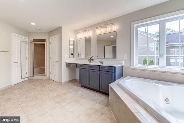 42720 Mount Auburn Pl, Broadlands, VA 20148 - full bath with vanity, a whirlpool tub, tile patterned floors, a shower stall, and baseboards