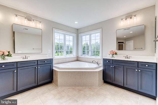 42720 Mount Auburn Pl, Broadlands, VA 20148 - bathroom with two vanities, tile patterned flooring, a garden tub, and recessed lighting