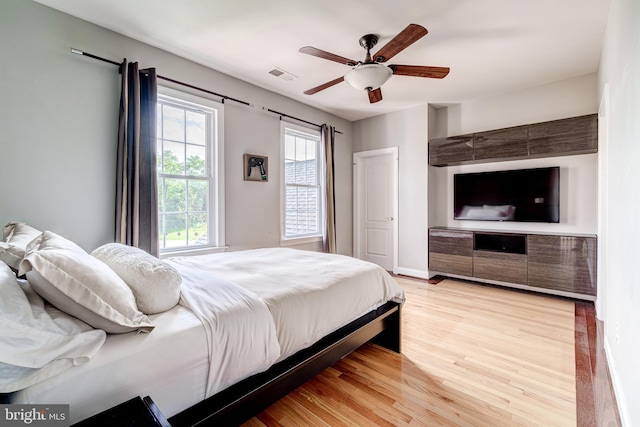 42720 Mount Auburn Pl, Broadlands, VA 20148 - bedroom featuring light wood-style flooring, ceiling fan, and baseboards