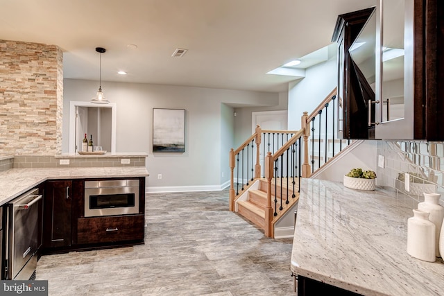 42720 Mount Auburn Pl, Broadlands, VA 20148 - kitchen with appliances with stainless steel finishes, dark brown cabinetry, tasteful backsplash, baseboards, and recessed lighting