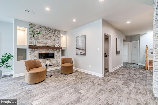 42720 Mount Auburn Pl, Broadlands, VA 20148 - living area with a fireplace, wood finished floors, baseboards, and recessed lighting