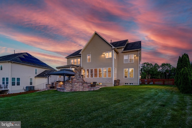 42720 Mount Auburn Pl, Broadlands, VA 20148 - back of house at dusk with a gazebo and central AC