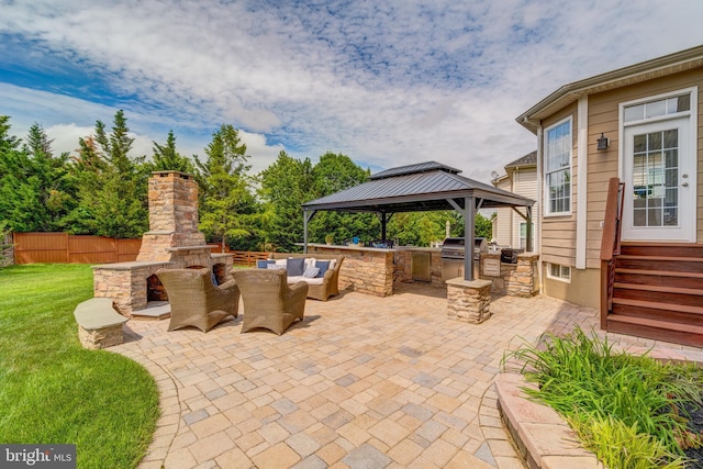 42720 Mount Auburn Pl, Broadlands, VA 20148 - view of patio with an outdoor stone fireplace and a gazebo