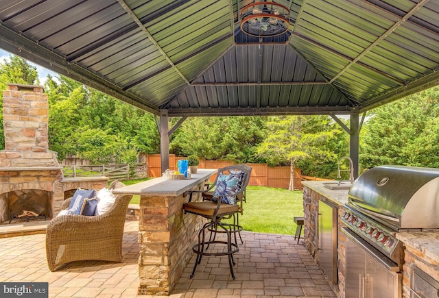 42720 Mount Auburn Pl, Broadlands, VA 20148 - view of patio / terrace featuring a gazebo and an outdoor stone fireplace