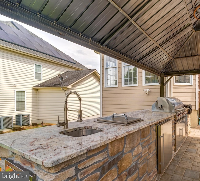 42720 Mount Auburn Pl, Broadlands, VA 20148 - view of patio / terrace with a sink, a gazebo, exterior kitchen, and central AC unit