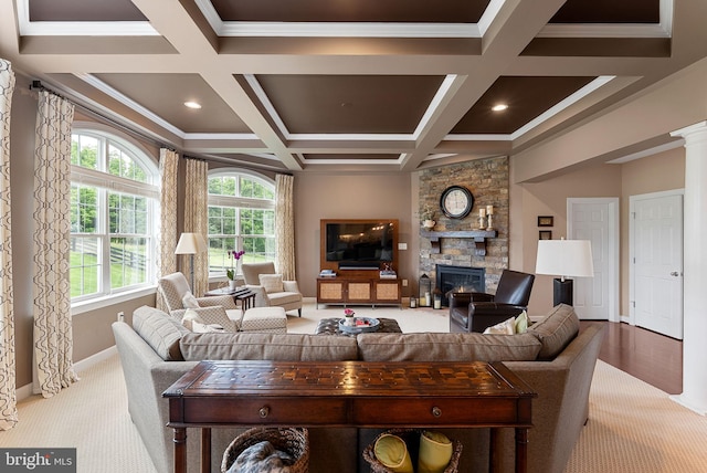 22415 Conservancy Dr, Ashburn, VA 20148 - living area featuring carpet flooring, a stone fireplace, coffered ceiling, beamed ceiling, and crown molding