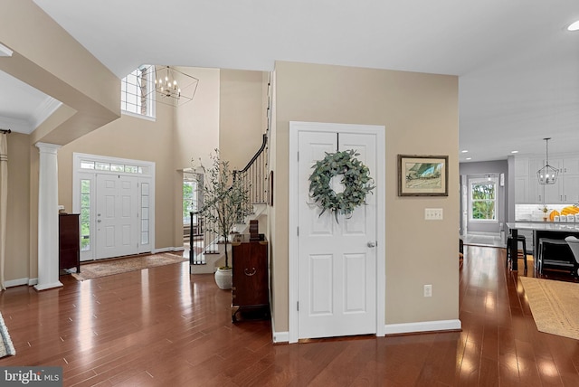 22415 Conservancy Dr, Ashburn, VA 20148 - foyer entrance featuring a chandelier, stairs, wood finished floors, baseboards, and recessed lighting