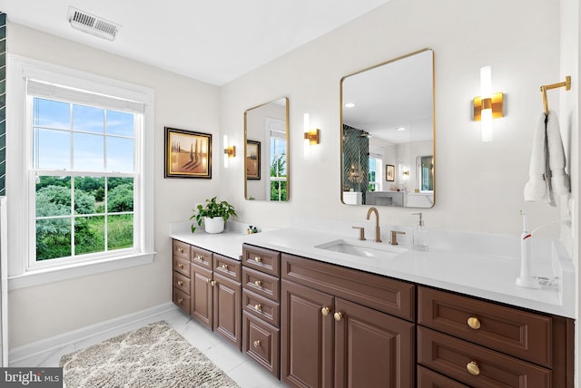 22415 Conservancy Dr, Ashburn, VA 20148 - full bathroom with healthy amount of natural light, vanity, and baseboards