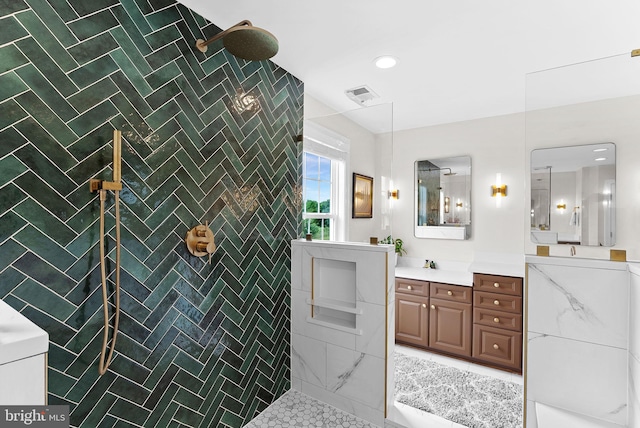 22415 Conservancy Dr, Ashburn, VA 20148 - bathroom with vanity, a tile shower, recessed lighting, and tile patterned flooring