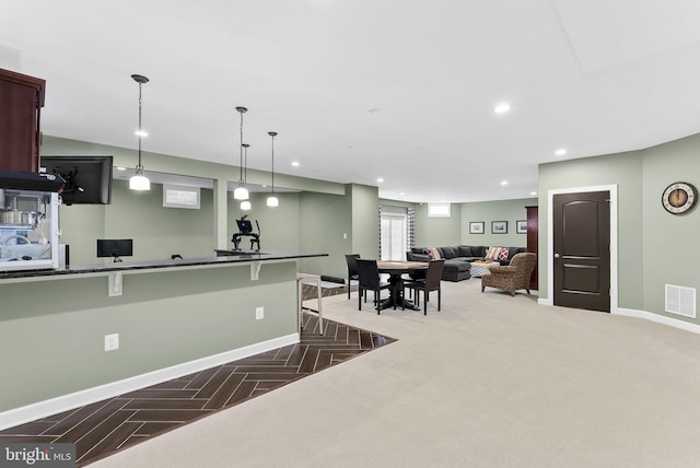 22415 Conservancy Dr, Ashburn, VA 20148 - kitchen featuring baseboards, a breakfast bar, hanging light fixtures, and recessed lighting
