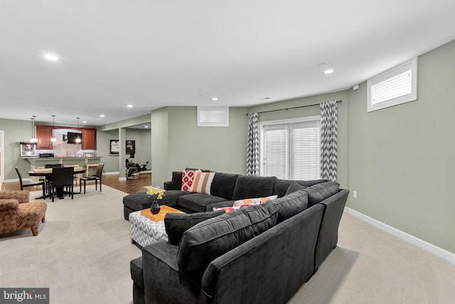 22415 Conservancy Dr, Ashburn, VA 20148 - living room featuring recessed lighting, baseboards, and light colored carpet