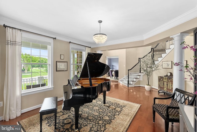 22415 Conservancy Dr, Ashburn, VA 20148 - sitting room featuring stairway, crown molding, baseboards, wood finished floors, and a chandelier