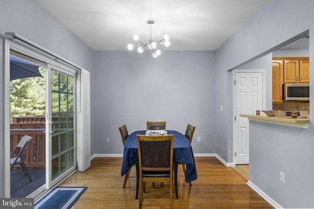 3 River Birch Cir, Princeton, NJ 08540 - dining space with a chandelier, light wood-type flooring, and baseboards