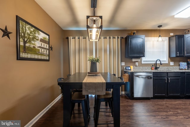 15245 Wedgewood Dr, Greencastle, PA 17225 - kitchen with stainless steel dishwasher, a sink, dark wood-style flooring, pendant lighting, and light stone countertops