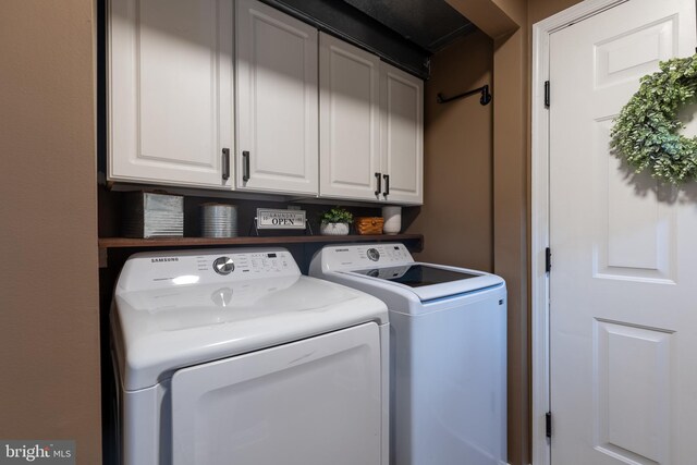 15245 Wedgewood Dr, Greencastle, PA 17225 - laundry room featuring washing machine and clothes dryer and cabinet space