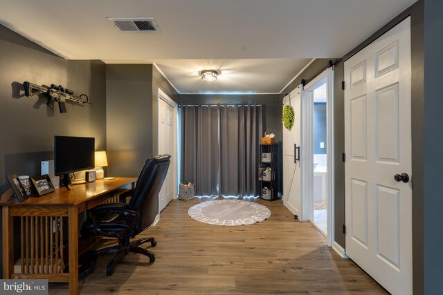15245 Wedgewood Dr, Greencastle, PA 17225 - office featuring wood finished floors, a barn door, and baseboards