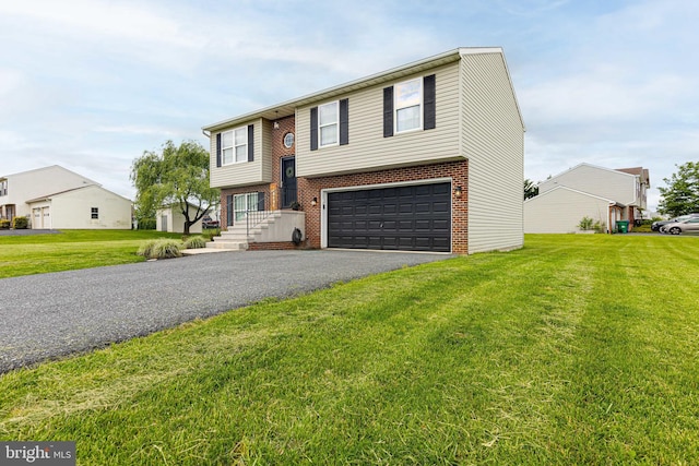 15245 Wedgewood Dr, Greencastle, PA 17225 - raised ranch with a garage, driveway, brick siding, and a front lawn