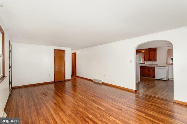 335 Bolton Ave, Carlisle, PA 17013 - unfurnished room with wood finished floors, arched walkways, and baseboards