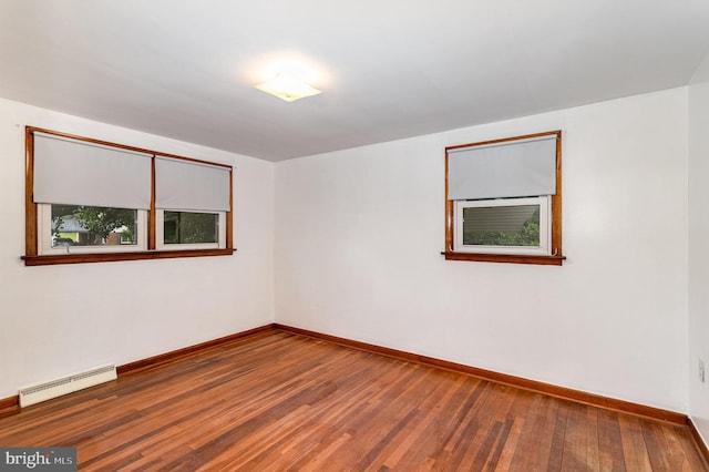 335 Bolton Ave, Carlisle, PA 17013 - empty room with a baseboard heating unit, baseboards, and wood finished floors