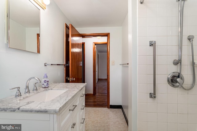 335 Bolton Ave, Carlisle, PA 17013 - full bath with vanity, a tile shower, and baseboards