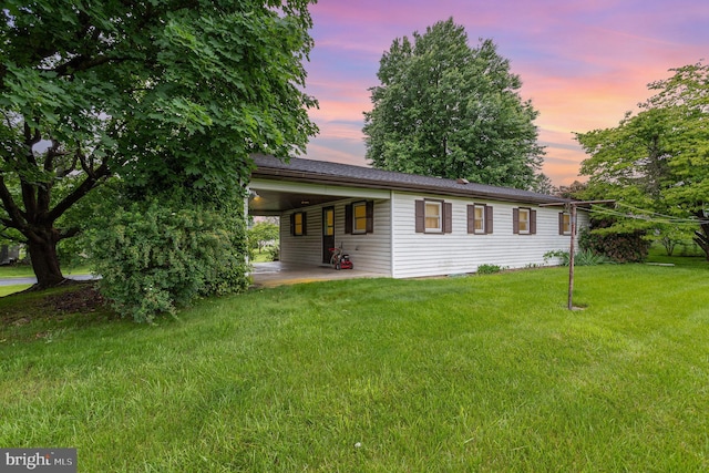 335 Bolton Ave, Carlisle, PA 17013 - view of front of house featuring a front yard, a patio, and a carport