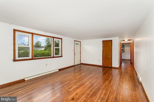 335 Bolton Ave, Carlisle, PA 17013 - spare room with baseboard heating, hardwood / wood-style floors, and baseboards