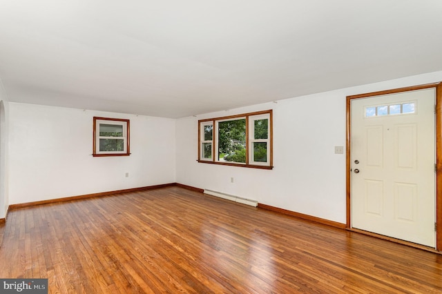 335 Bolton Ave, Carlisle, PA 17013 - foyer entrance with a baseboard heating unit, healthy amount of natural light, baseboards, and wood finished floors