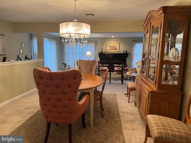 3001 E Chestnut Ave Unit G62, Vineland, NJ 08361 - dining room featuring light carpet, a chandelier, and baseboards