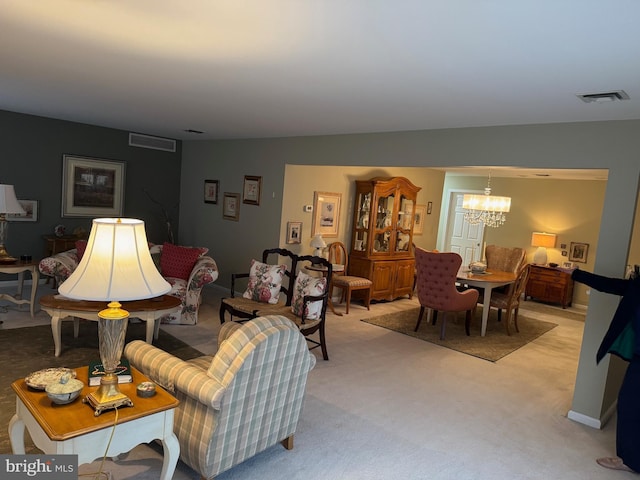 3001 E Chestnut Ave Unit G62, Vineland, NJ 08361 - living room featuring a chandelier and light carpet