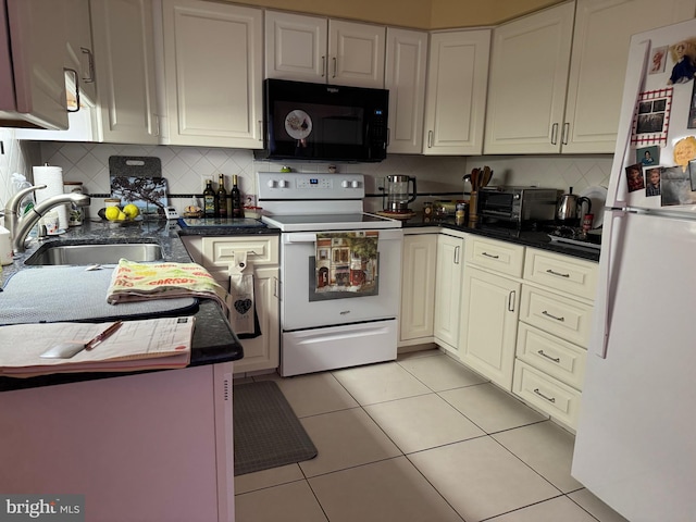 3001 E Chestnut Ave Unit G62, Vineland, NJ 08361 - kitchen featuring white appliances, a sink, decorative backsplash, light tile patterned floors, and dark stone counters