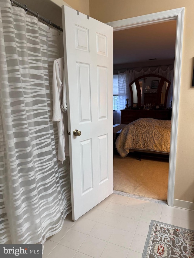 3001 E Chestnut Ave Unit G62, Vineland, NJ 08361 - ensuite bathroom with tile patterned flooring and a shower with shower curtain