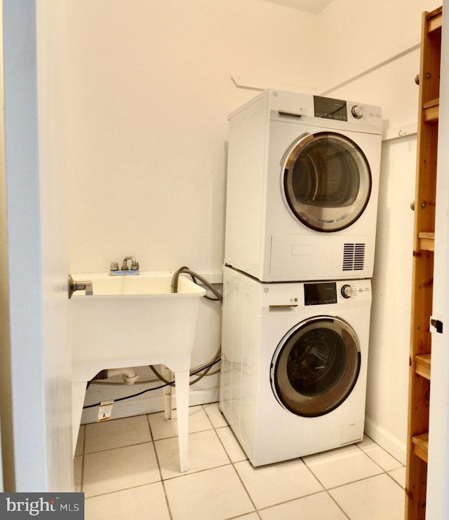 2401 Pennsylvania Ave Unit 6B29, Philadelphia, PA 19130 - washroom with stacked washing machine and dryer and light tile patterned flooring