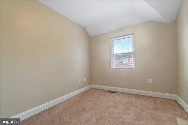 1317 Winston Ave, Baltimore, MD 21239 - unfurnished room featuring lofted ceiling and light carpet