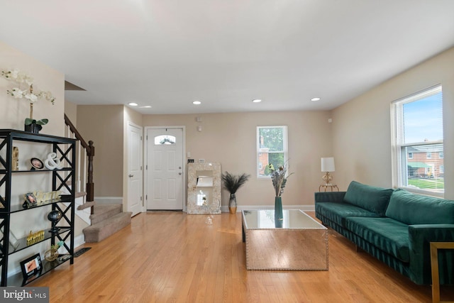 1317 Winston Ave, Baltimore, MD 21239 - living area featuring stairway, light wood-type flooring, and recessed lighting