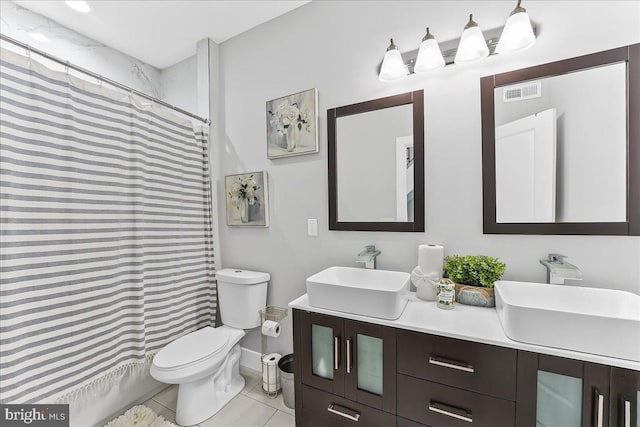 721 Daly St, Philadelphia, PA 19148 - bathroom with toilet, double vanity, tile patterned flooring, a shower with shower curtain, and baseboards