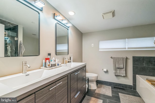 211 Brown St Unit 15, Philadelphia, PA 19123 - full bath featuring double vanity, a garden tub, toilet, baseboards, and tile patterned flooring